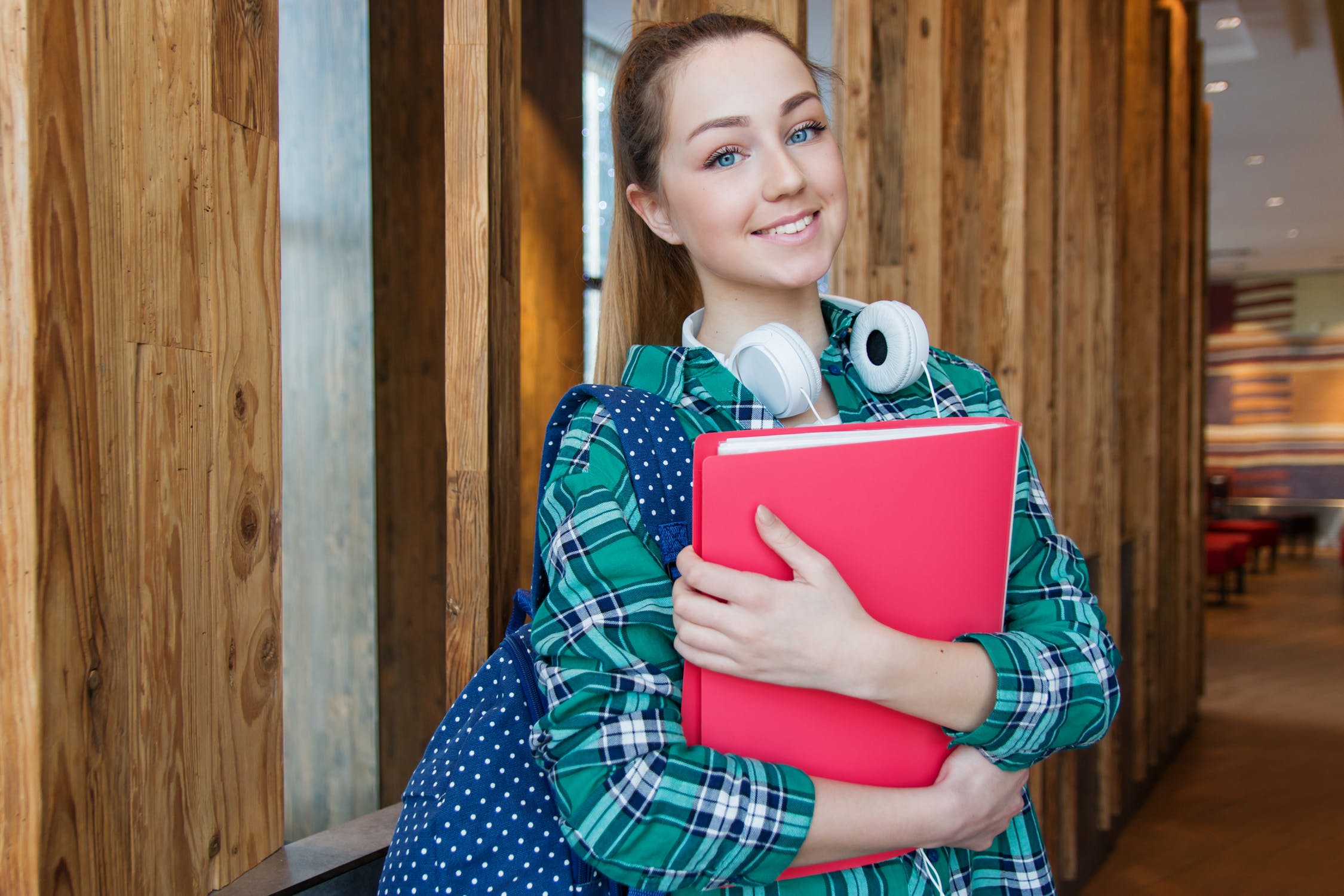 Student holding some documents